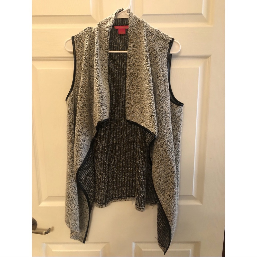 Sleeveless cardigan with waterfall hem